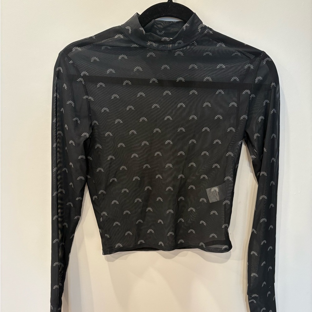 Cozi Mesh Black Long Sleeve Top with a Sun Design